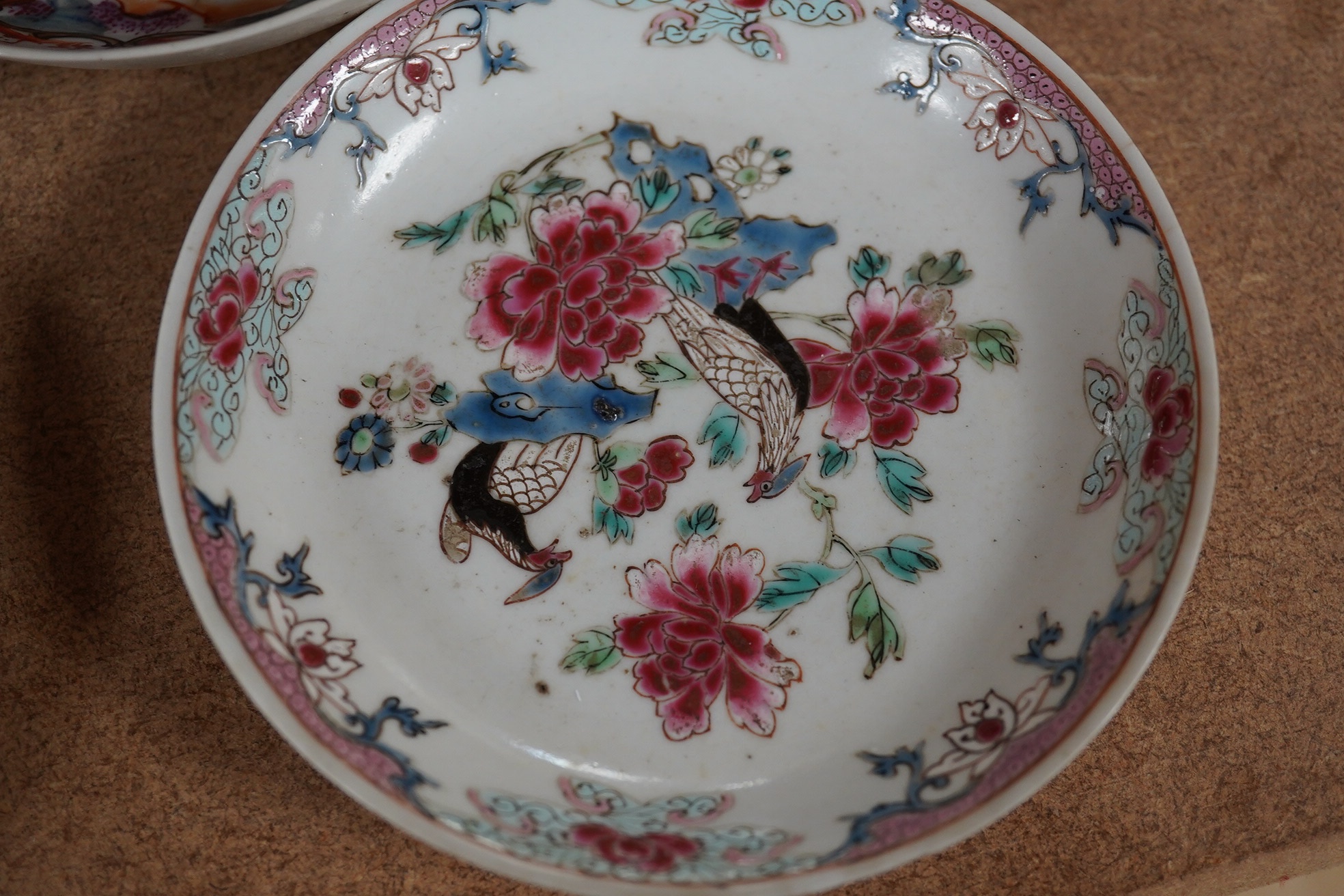 A Chinese porcelain famille rose 'double pheasant' tea bowl and saucer and a Mandarin pattern coffee cup and saucer, all Qianlong period, largest 11.5cm diameter. Condition - one saucer broken, others fair to good